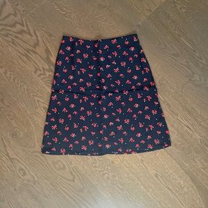 BRANDY MELVILLE navy mini skirt with red flowers